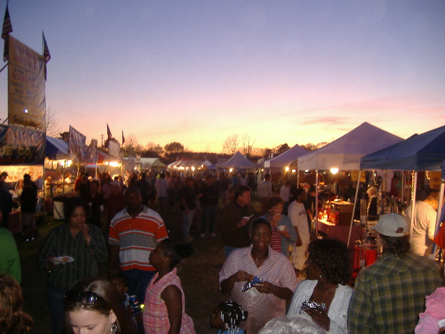 The sun sets on a wildly successful Saturday at the 4th Pork in the Park rib festival, April 21, 2007.